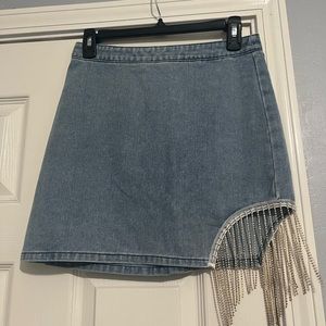 Denim skirt with diamonds dangling on slit